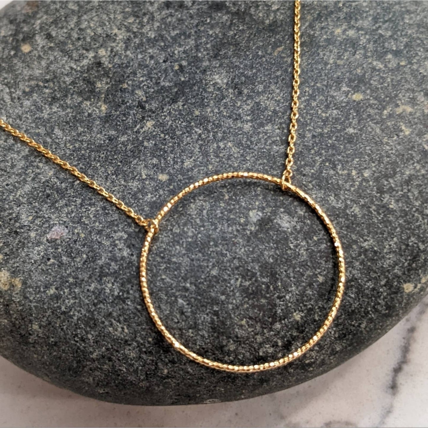 Dainty Gold Circle Necklace with a Hint of Sparkle