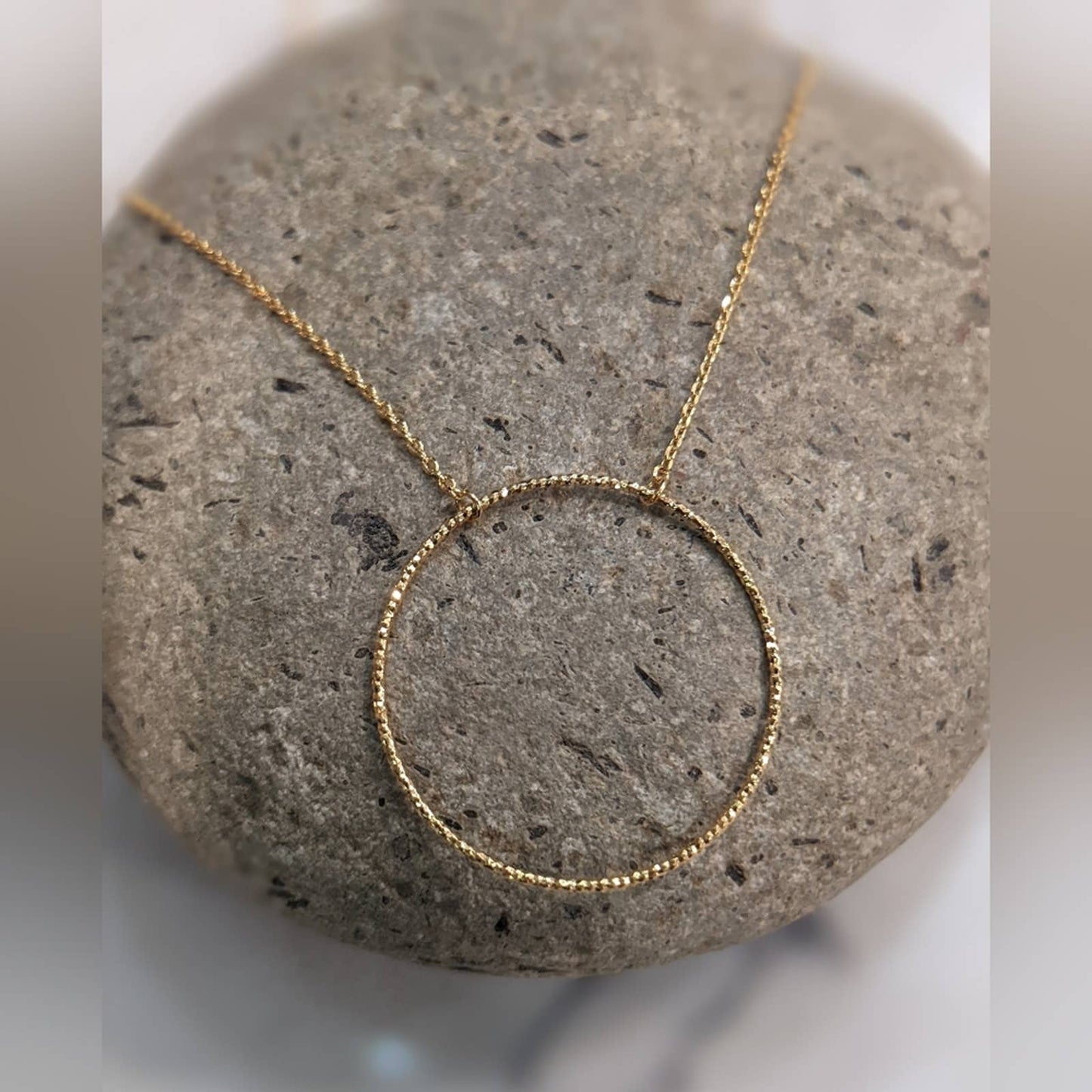 Dainty Gold Circle Necklace with a Hint of Sparkle