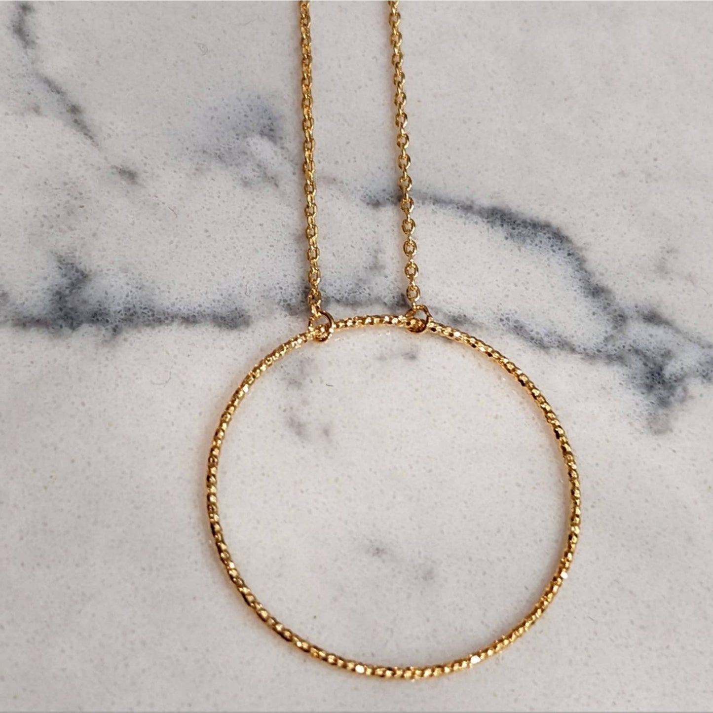 Dainty Gold Circle Necklace with a Hint of Sparkle