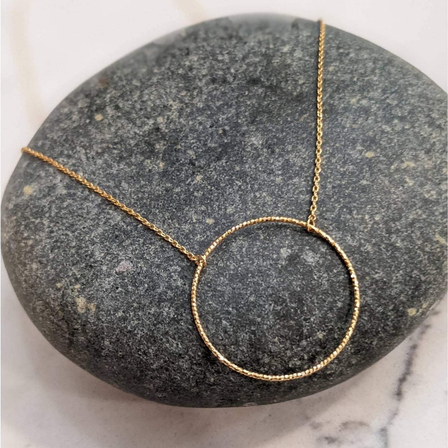Dainty Gold Circle Necklace with a Hint of Sparkle